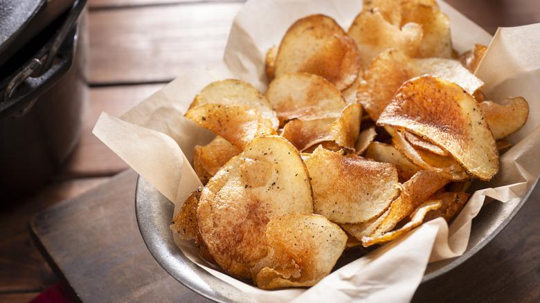 Potato chips in metal bowl