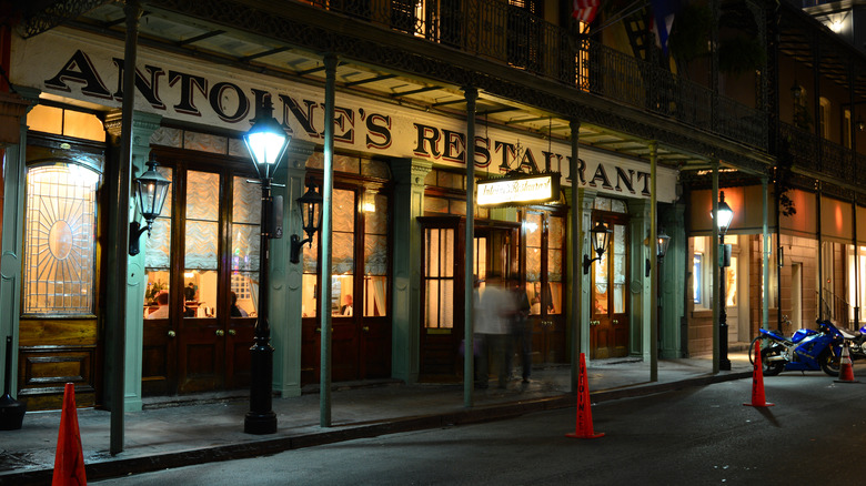 Lit exterior of Antoine's restaurant at night