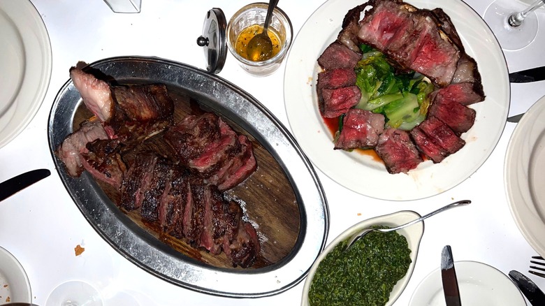 Top-down view of mutton and steak dishes at Keens Steakhouse