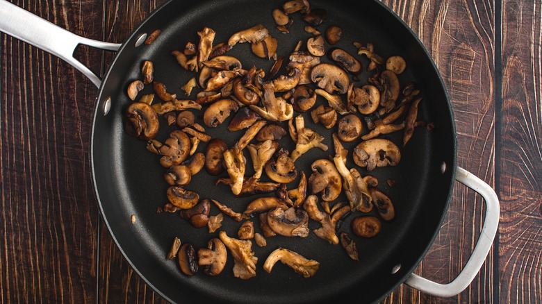 Sautéed mushrooms in pan