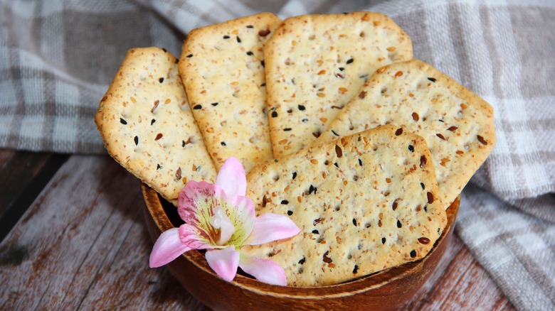 Cumin crackers in wooden bowl