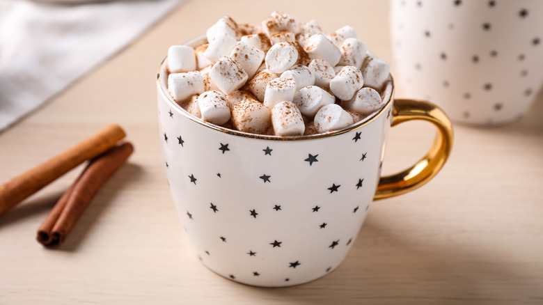 Hot cocoa with marshmallows in starry mug
