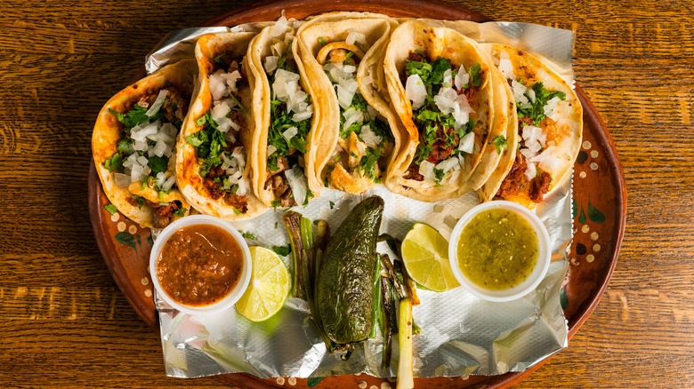 Plate of tacos with salsa
