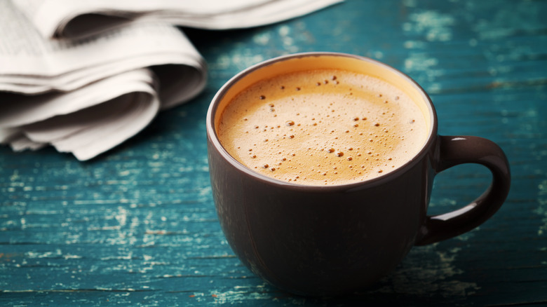 caffè latte on wooden table