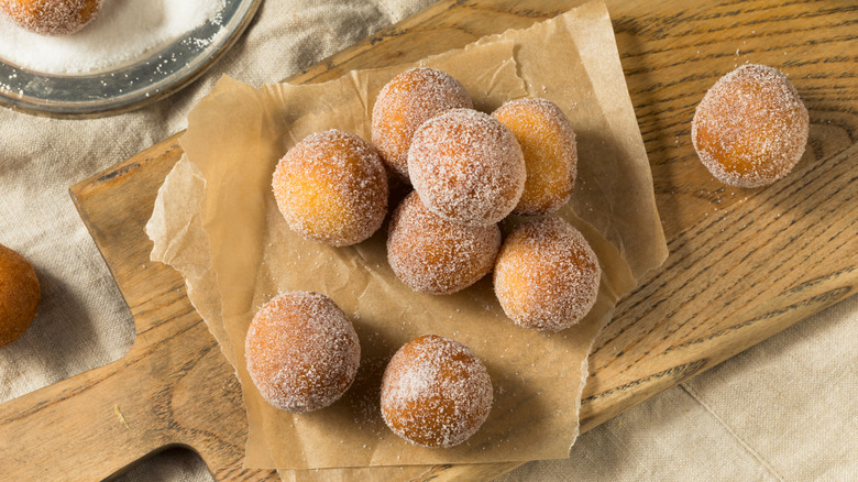 Homemade fried cake donut holes with sugar