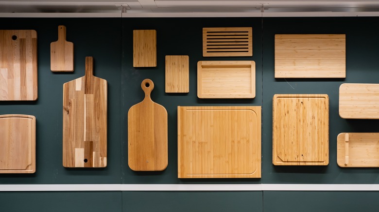 various sized chopping boards arranged on a wall