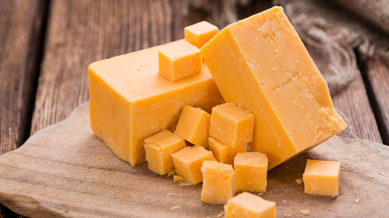 Several blocks of cheddar cheese