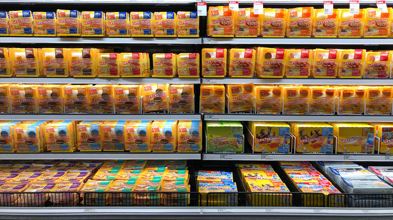 lunchables arranged on shelf in grocery store