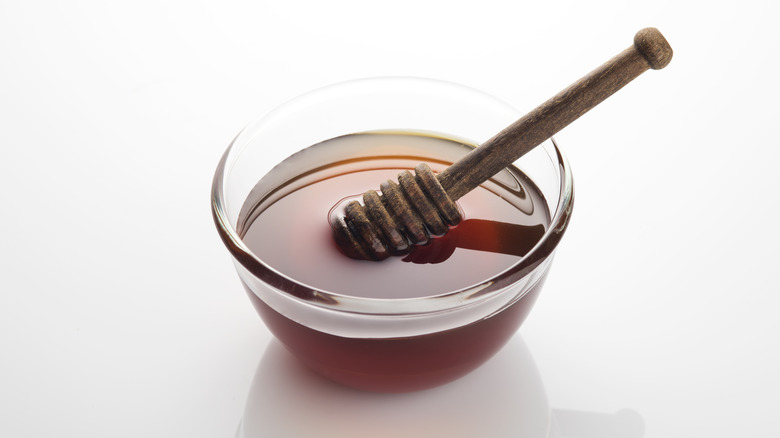 glass bowl and honey dipper