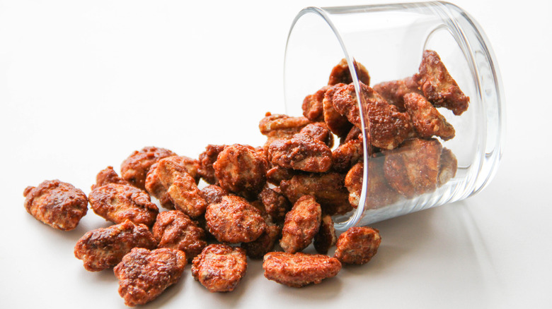 praline pecans spilling out of glass