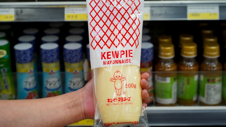 Person holding bottle of Kewpie Mayonnaise