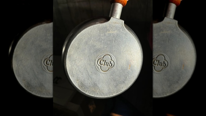 Underside of a small Club frying pan showing the logo on the pan