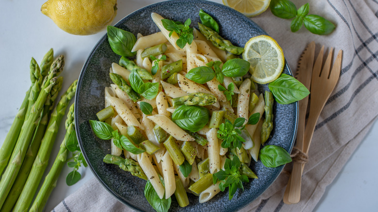 pasta primavera in bowl with fresh herbs