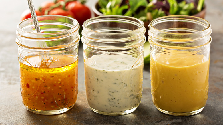 Variety of salad dressings in mason jars