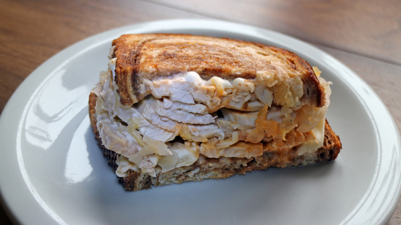 A Rachel sandwich on a white plate