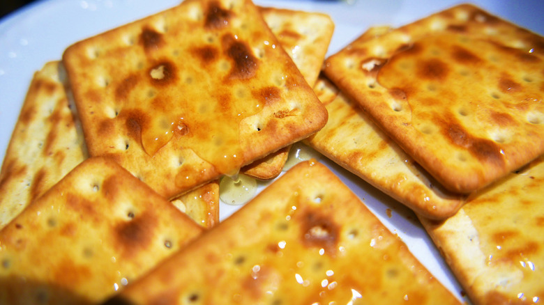 Toasted and golden-brown Buttered Saltines drizzled in honey