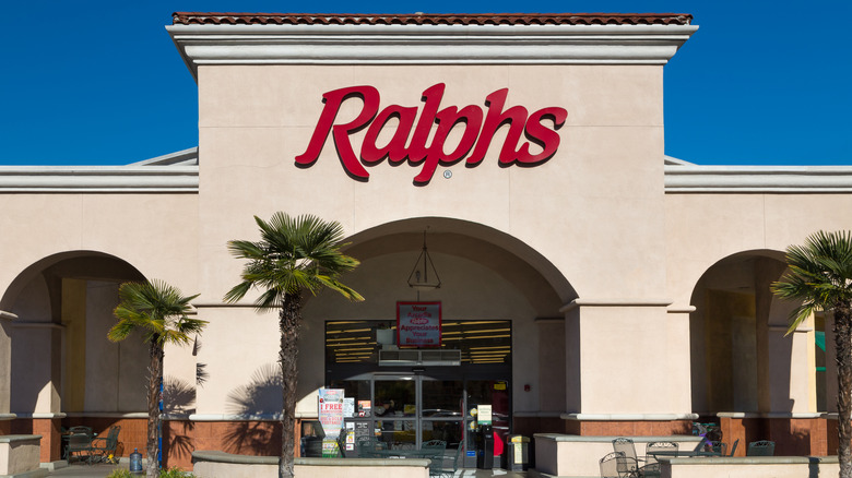 Ralphs grocery store with red sign and stucco arched facade.