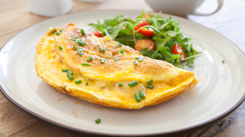 Omelet and salad on plate