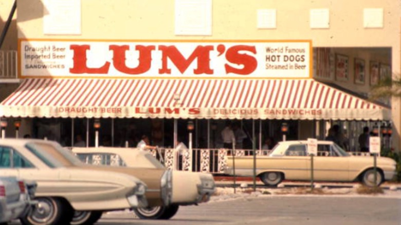 LUM's exterior with a striped awning and big, red-lettered sign