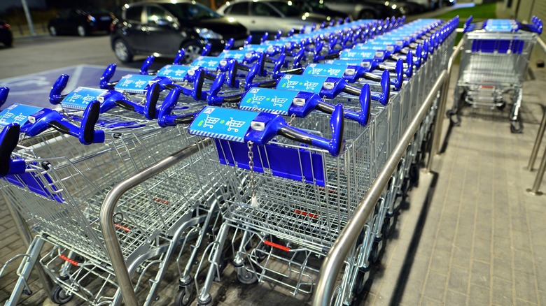 shopping carts in a row in an Aldi parking lot