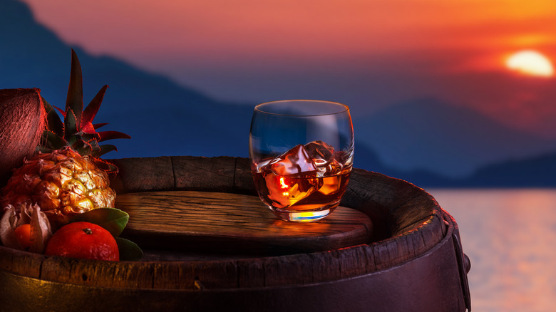 sun setting over rum barrel