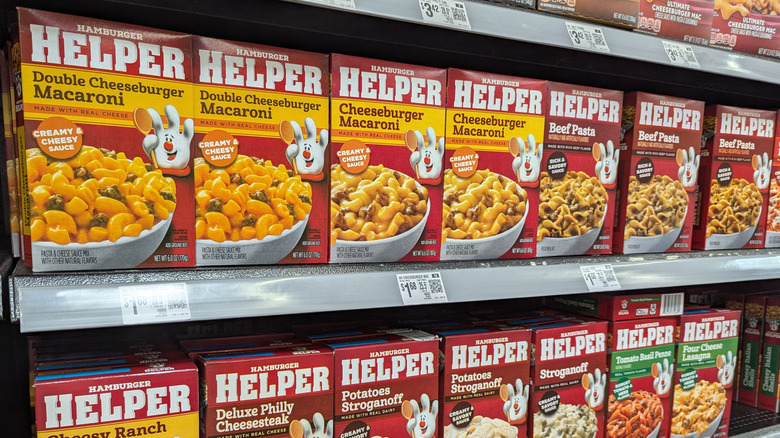 Various Hamburger Helper options on grocery store shelf