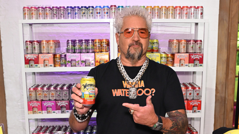 Guy Fieri holding a can