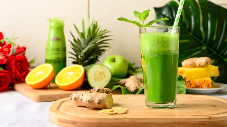 green juice surrounded by fruit