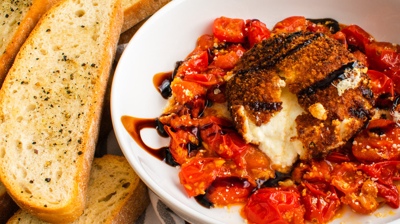 Fried burrata with tomatoes and toast