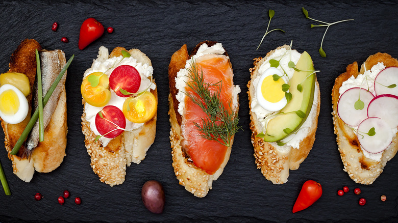 Bruschetta bread with ricotta, lox, and tomatoes