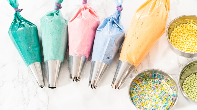 Colorful frosting in piping bags