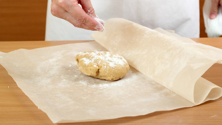 Dough between two sheets of paper 