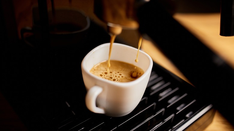 pulling a shot of espresso with crema