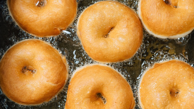 fresh donuts frying in oil