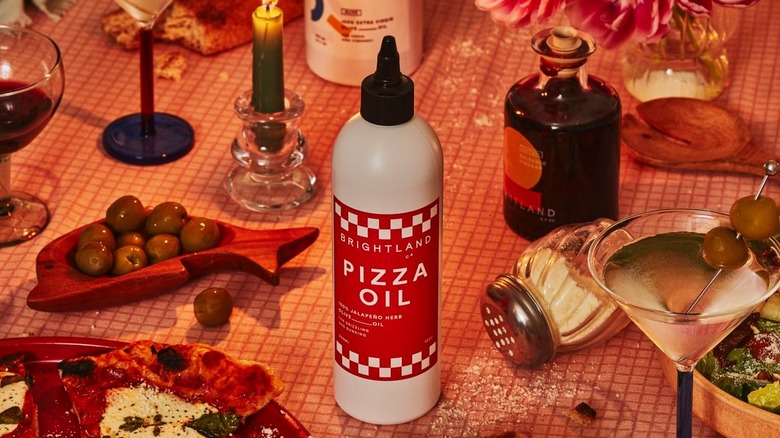 bottle of Brightland pizza oil on table