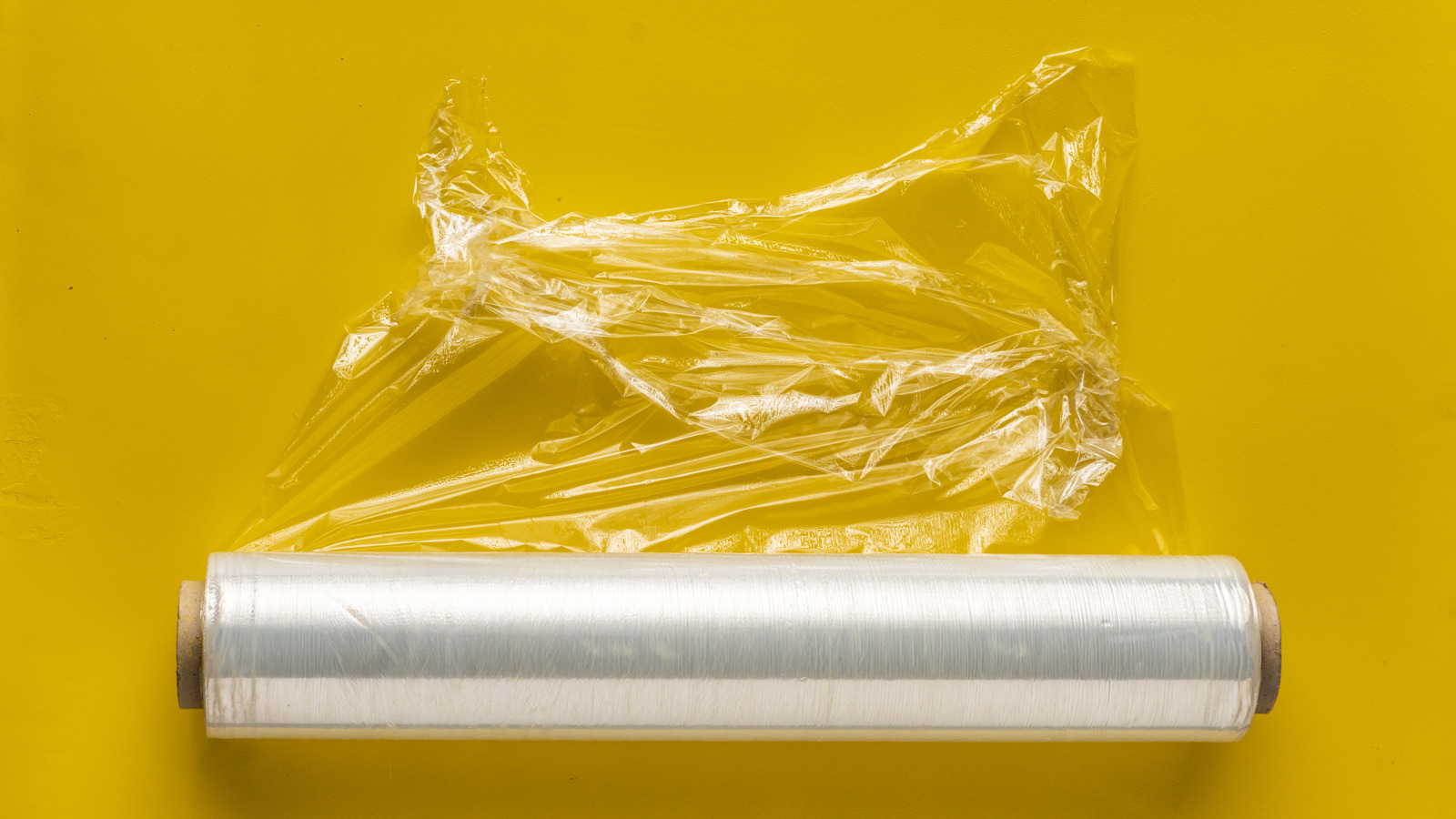 The Plastic Wrap Hack For Way Easier Fridge Cleanup
