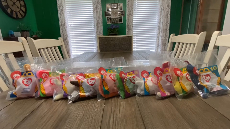 Collection of '90s McDonald's Teenie Beanie Babies on wooden table