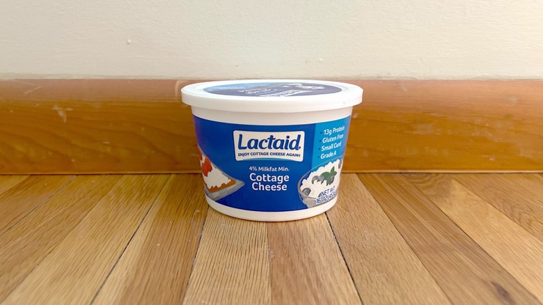 Container of Lactaid cottage cheese on wood counter