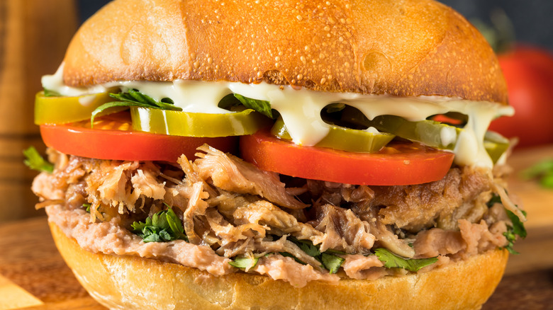 Torta with pork, tomatoes, jalapeños