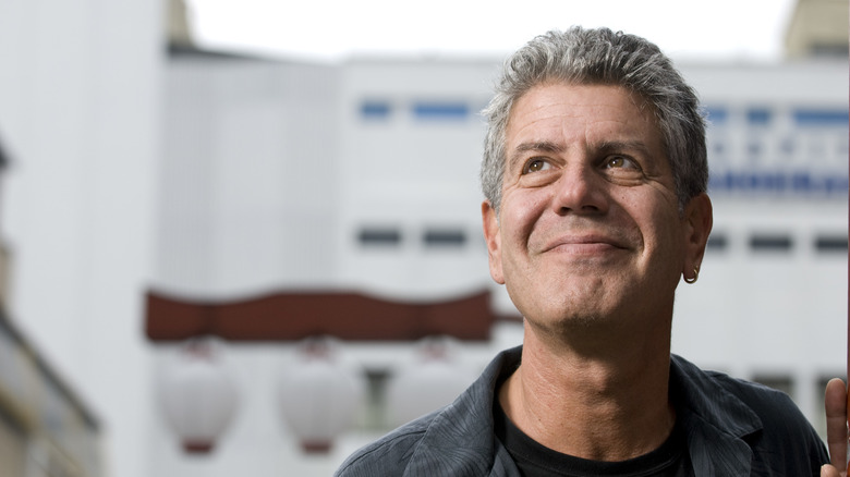 Anthony Bourdain looking up and smiling