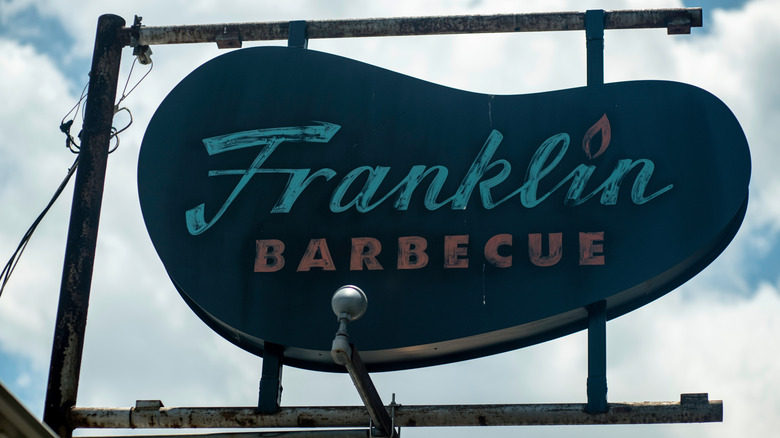 Franklin Barbecue sign against cloudy sky