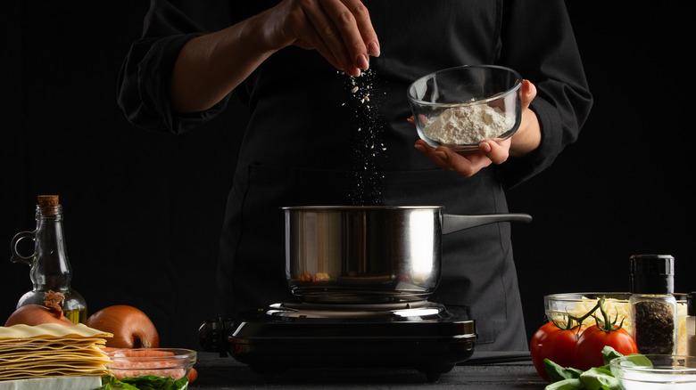 Sprinkling flour into pot