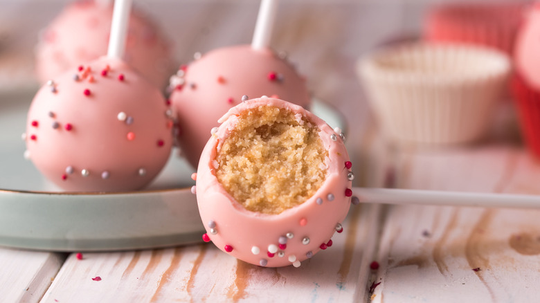 decorated cake pops with one bitten