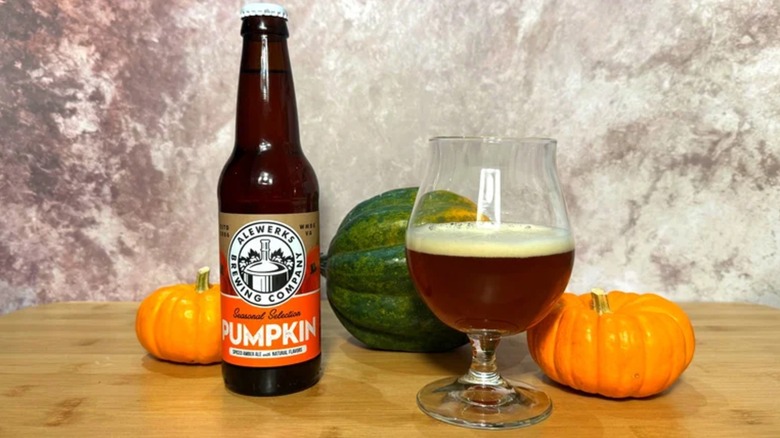 A bottle of Alewerks Pumpkin Ale, with some poured into a beer glass