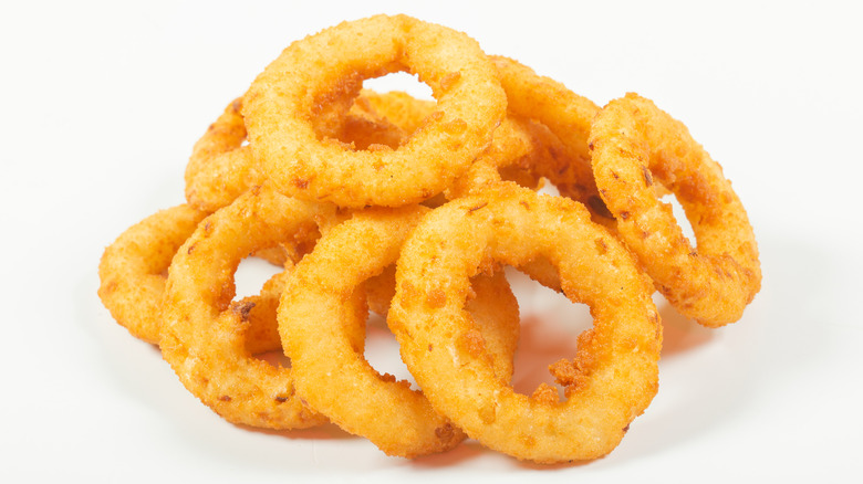 Onion rings on blank surface