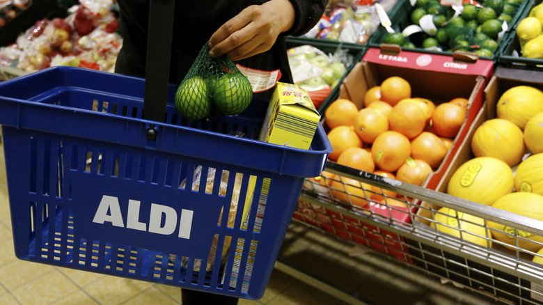 Customer in Aldi with groceries