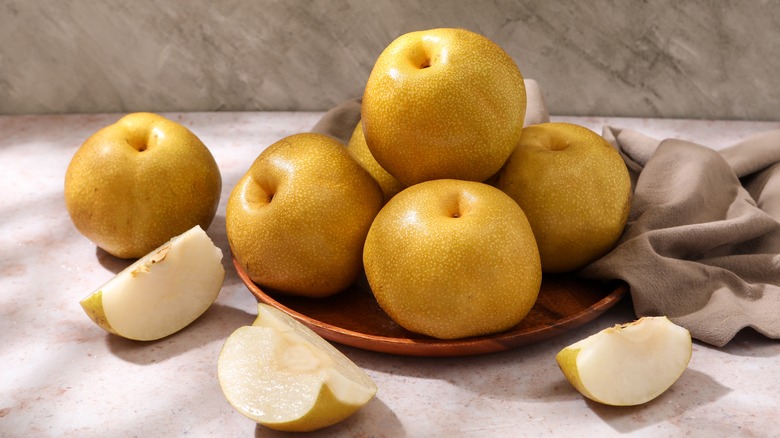 round, yellow, asian pears on a plate