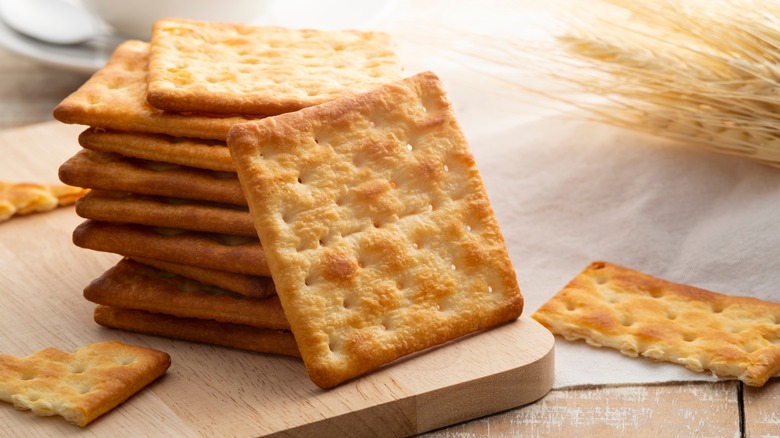 Crackers on wooden board