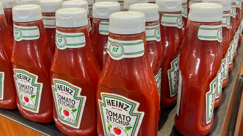 Heinz tomato ketchup bottles on store shelf display