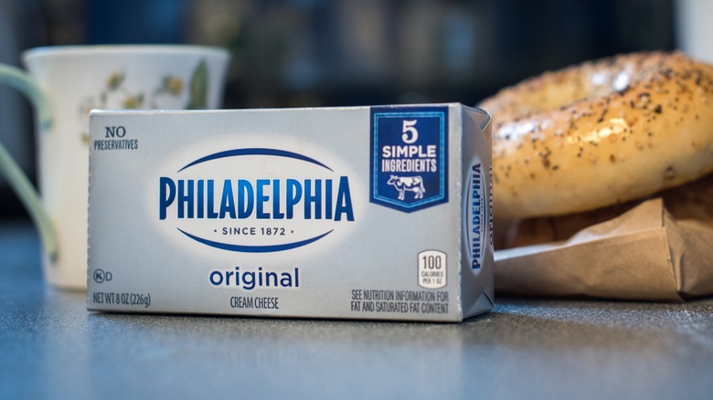 Philadelphia cream cheese and bagel on counter
